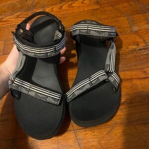 Black and white Teva sandals